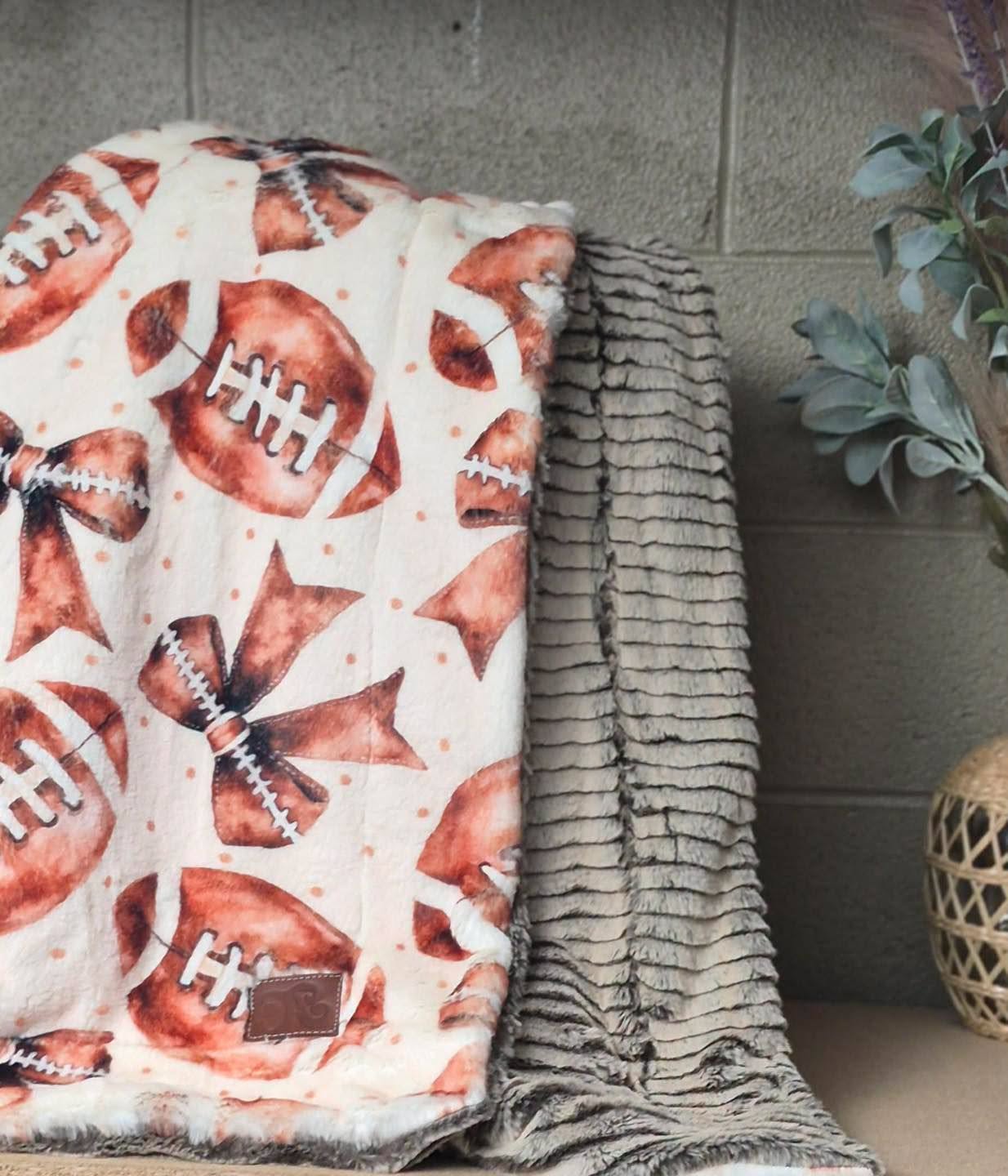 WAF 60x90 footballs and bows on seal/ chocolate almond oceana