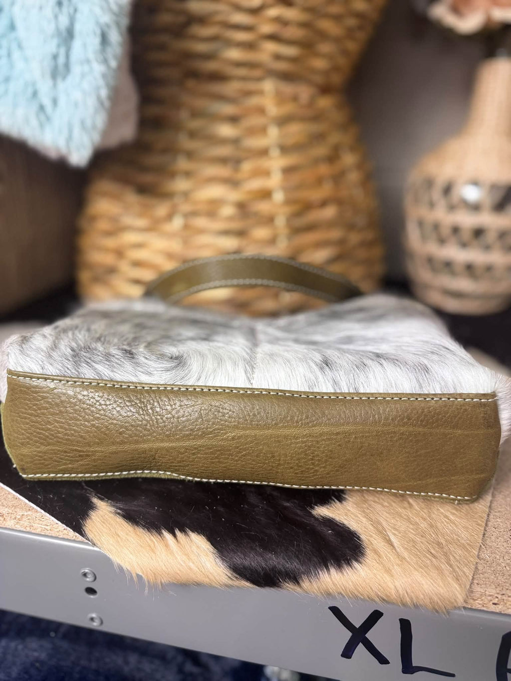 Olive suede daisy bag with salt and pepper hair on hide