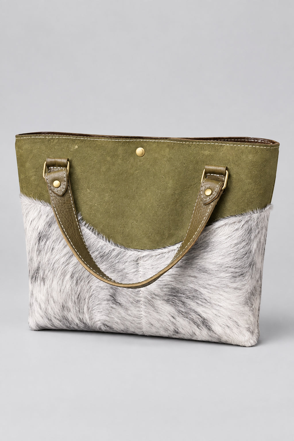 Olive suede daisy bag with salt and pepper hair on hide