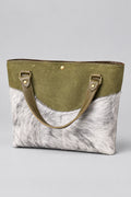 Olive suede daisy bag with salt and pepper hair on hide